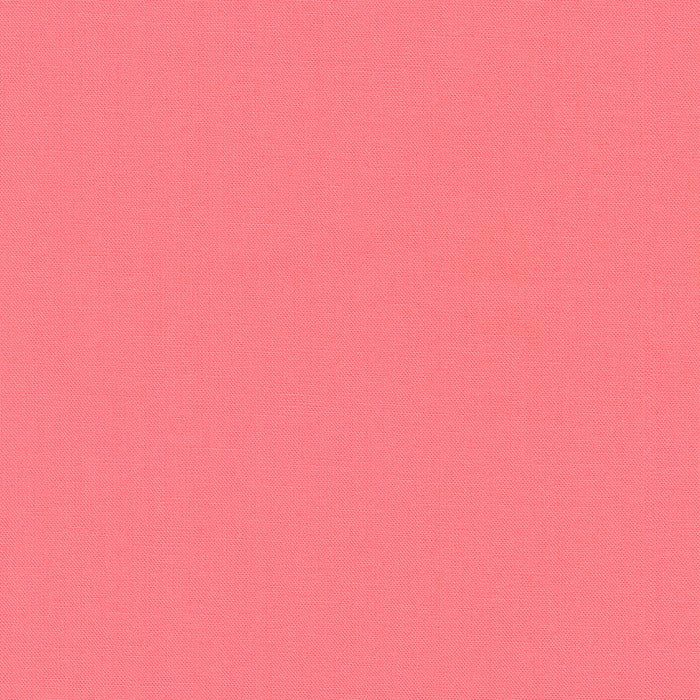 Melon Kona Cotton solid fabric by Robert Kaufman. 100% cotton fabric in a pink color.