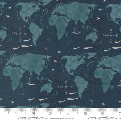 Longshore Seafarers Way Night quilting fabric by Janet Clare. 100% cotton fabric with a repeating world map pattern featuring sailboats, airplanes, and compass roses in a dark blue color. Ideal for coastal-themed projects.