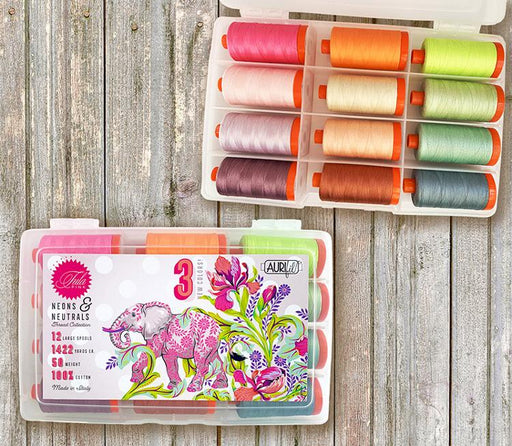 Tula Pink thread kit from Aurifil titled Neons and Neutrals showing the case and spools of thread