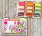 Tula Pink thread kit from Aurifil titled Neons and Neutrals showing the case and spools of thread