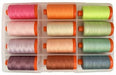 Tula Pink thread kit from Aurifil titled Neons and Neutrals showing the spools of thread